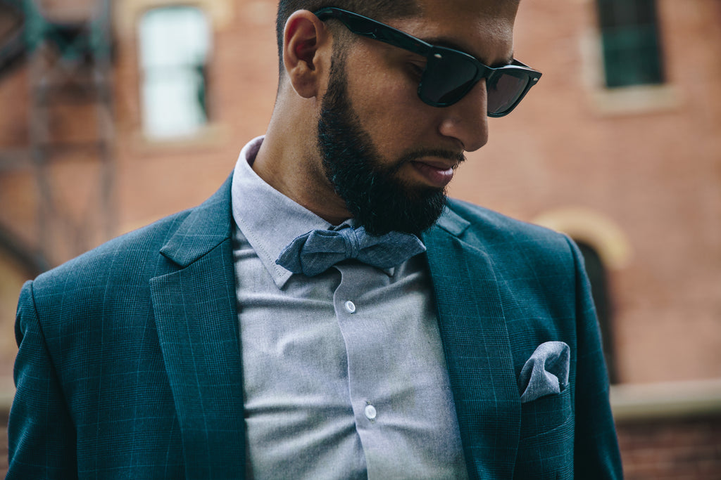 man wearing shades and bowtie