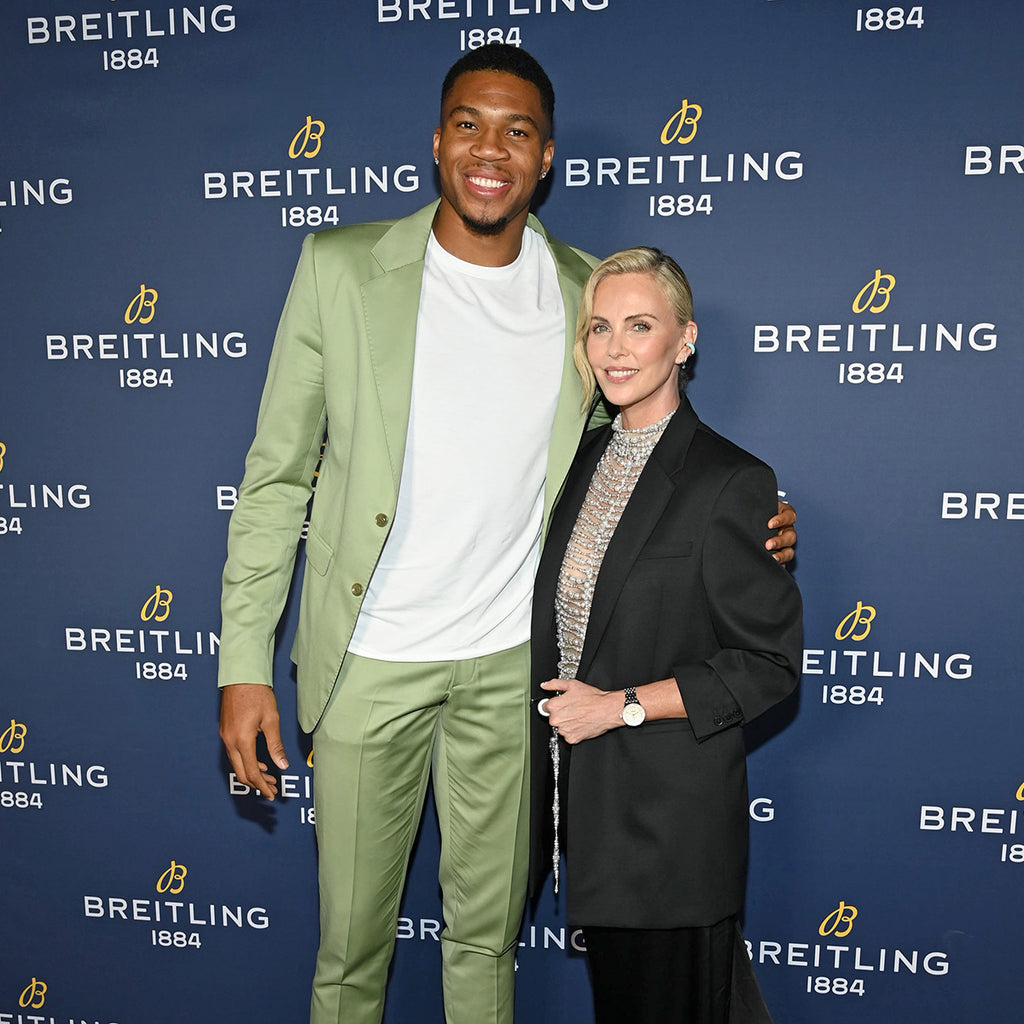 Giannis Antetokounmpo and Charlize Theron at Breitling event. 