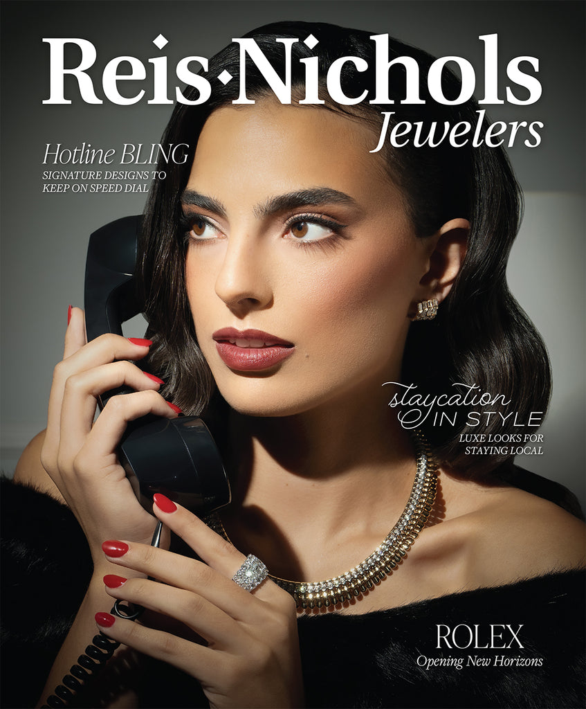Image of Magazine cover for Reis-Nichols Jewelers featuring a woman modeling diamond jewelry and a phone.