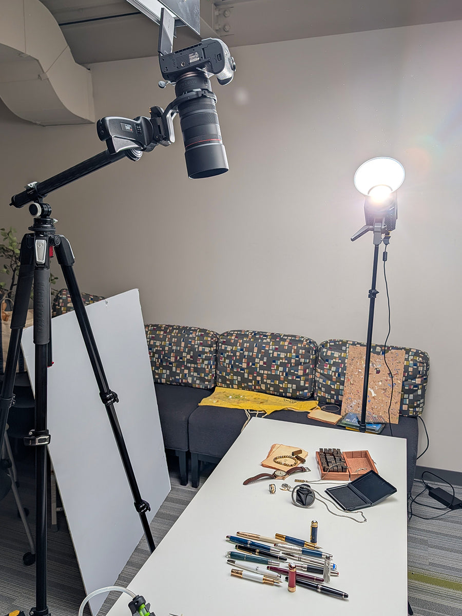Photoshoot set up behind-the-scenes image of the Father's Day jewelry spread and pen spread from the Reis-Nichols catalog