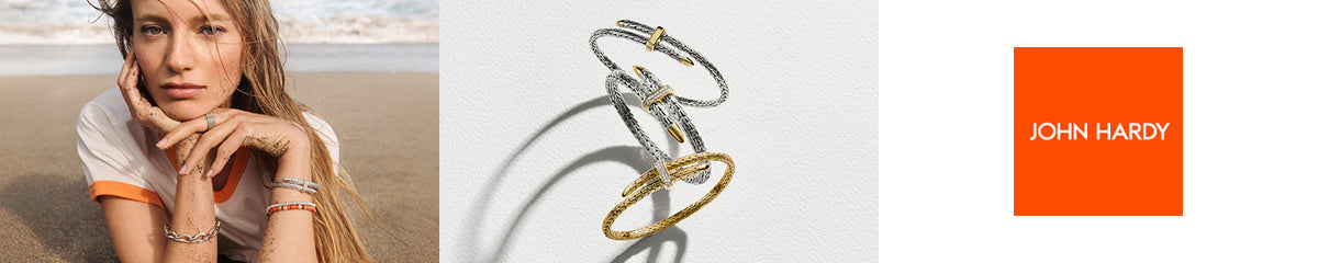 John Hardy jewelry: a model wearing stacked bracelets on the beach, gold and silver Spear flex cuffs, and the John Hardy logo
