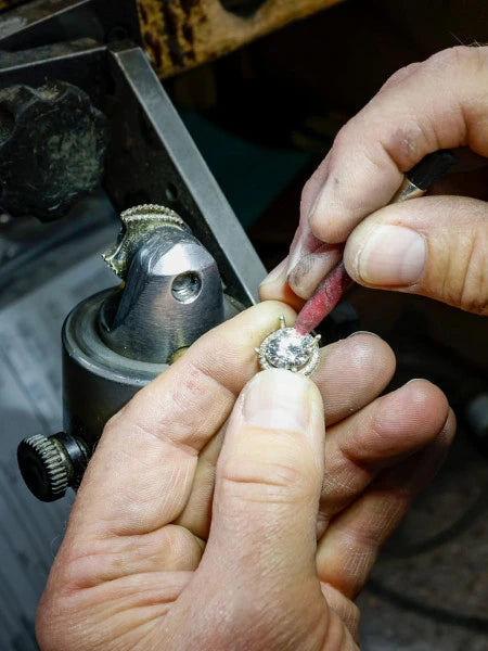 Image of Jeweler setting a stone - Learn about Custom Jewelry at Reis-Nichols
