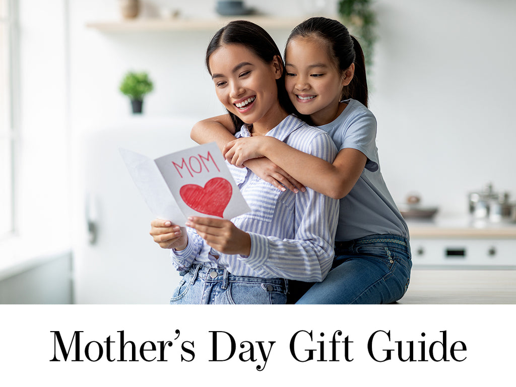 Mother's Day Gift Guide - Mom and Daughter Celebrating Mother's Day. Daughter giving mom a card to open