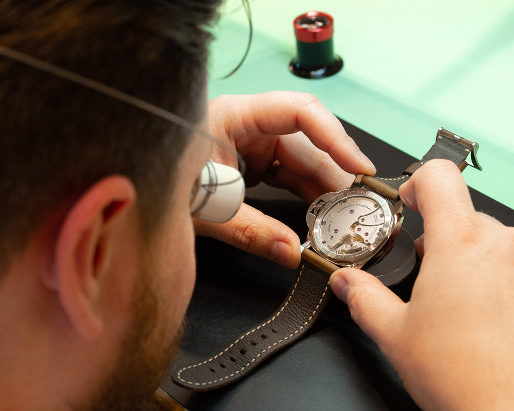 watchmaker working on watch